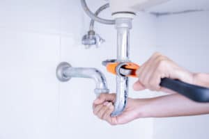 Plumber,Working,In,The,Bathroom,,Plumbing,Repair,Service,,Repairing,Leaking