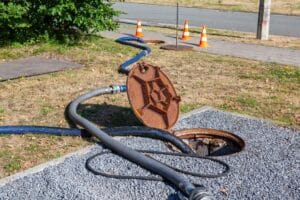 plumber cleaning sewer line