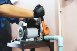 plumber uses wrench