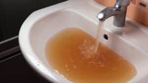 dirty water coming out of a faucet