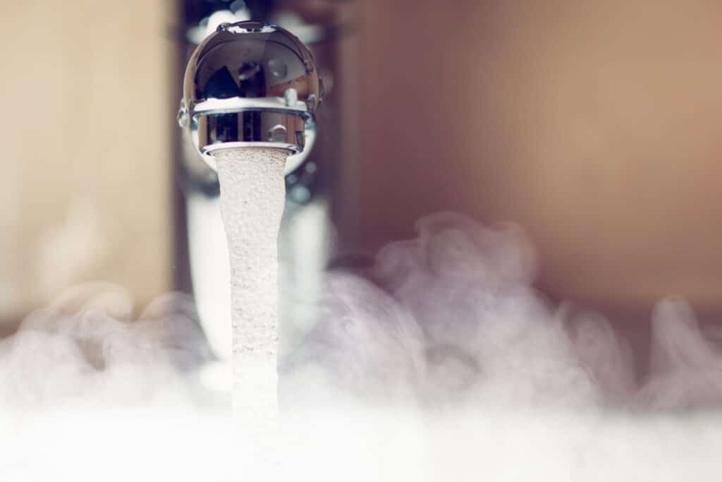 hot water steaming out of faucet