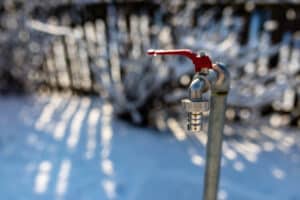 Closed garden water tap close up shot at wintertime , beautiful winter light